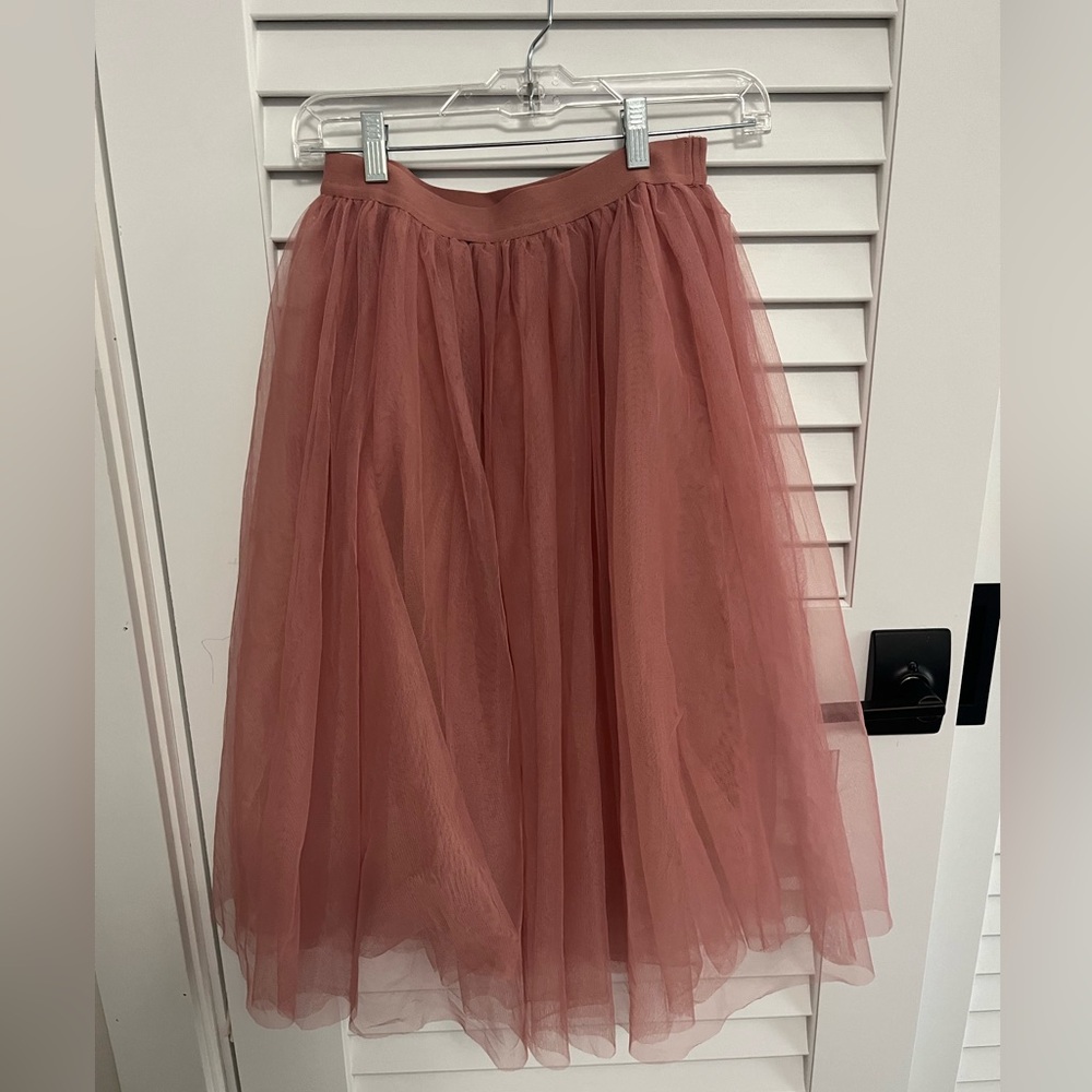 A dark peach skirt , knee length. Hardly been worn!